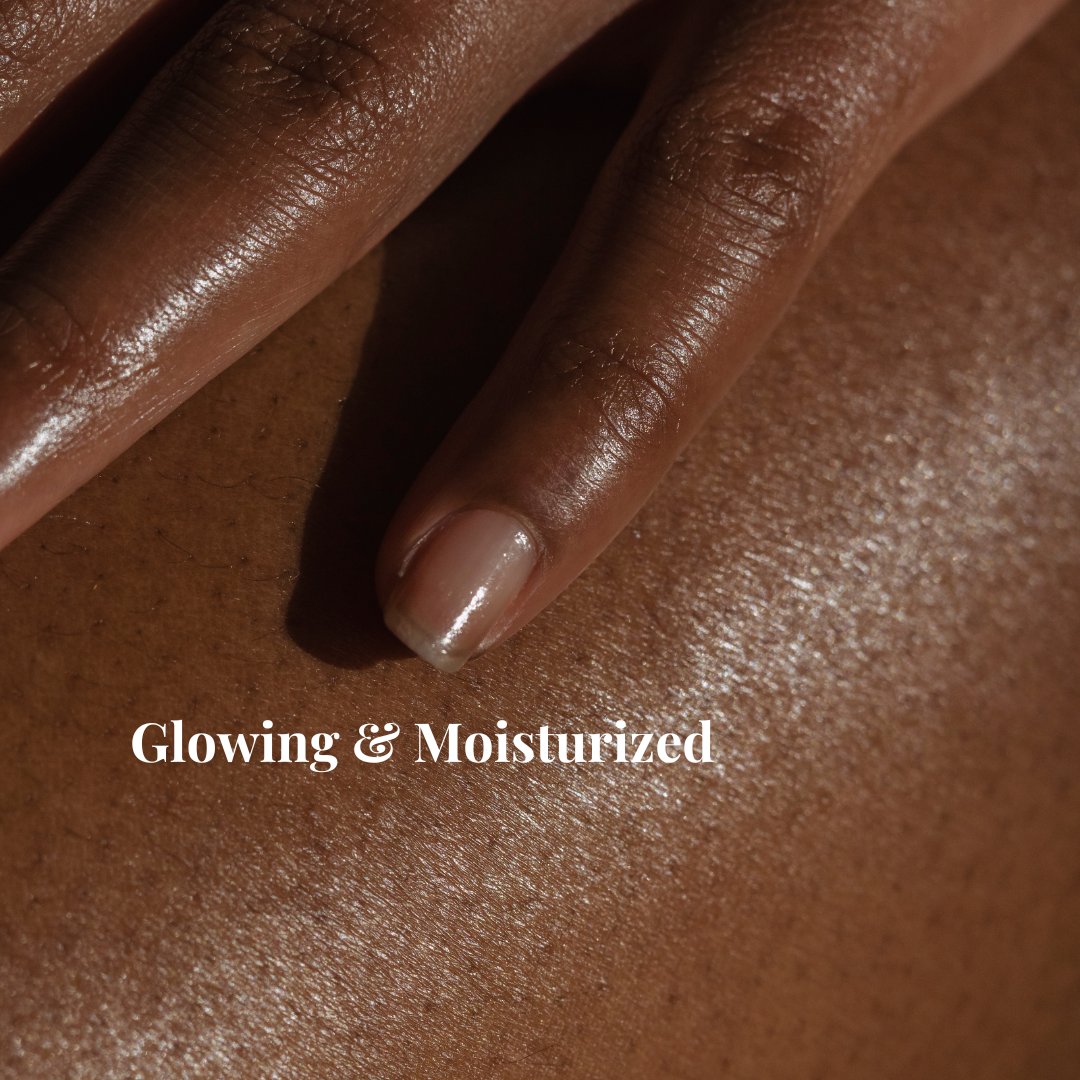 Black woman's hand on her leg, showcasing her moisturized skin after using Azizah Healing
